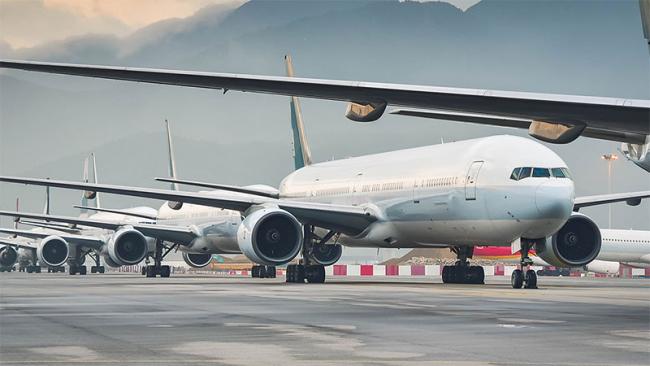 Aircrafts are seen lined up at an Airport