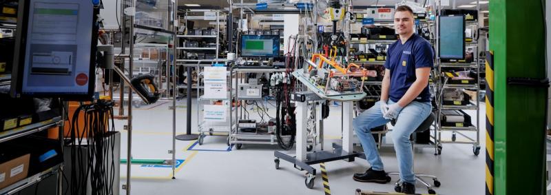 Employee sitting in the Vaisala weather factory