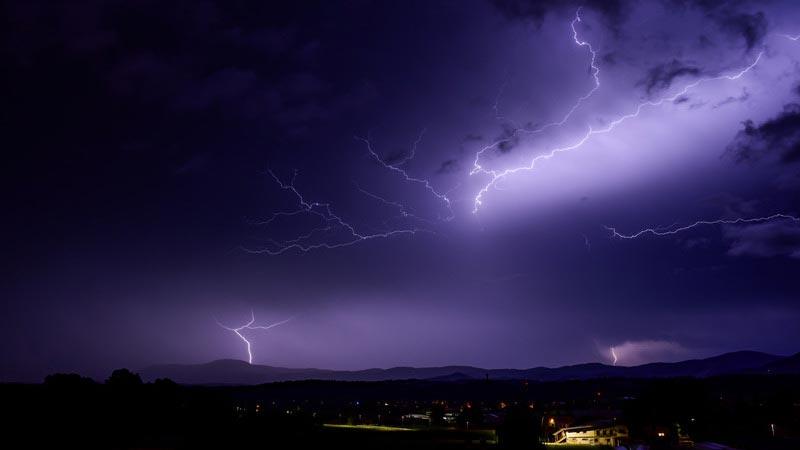 Purple lightning during summer storm